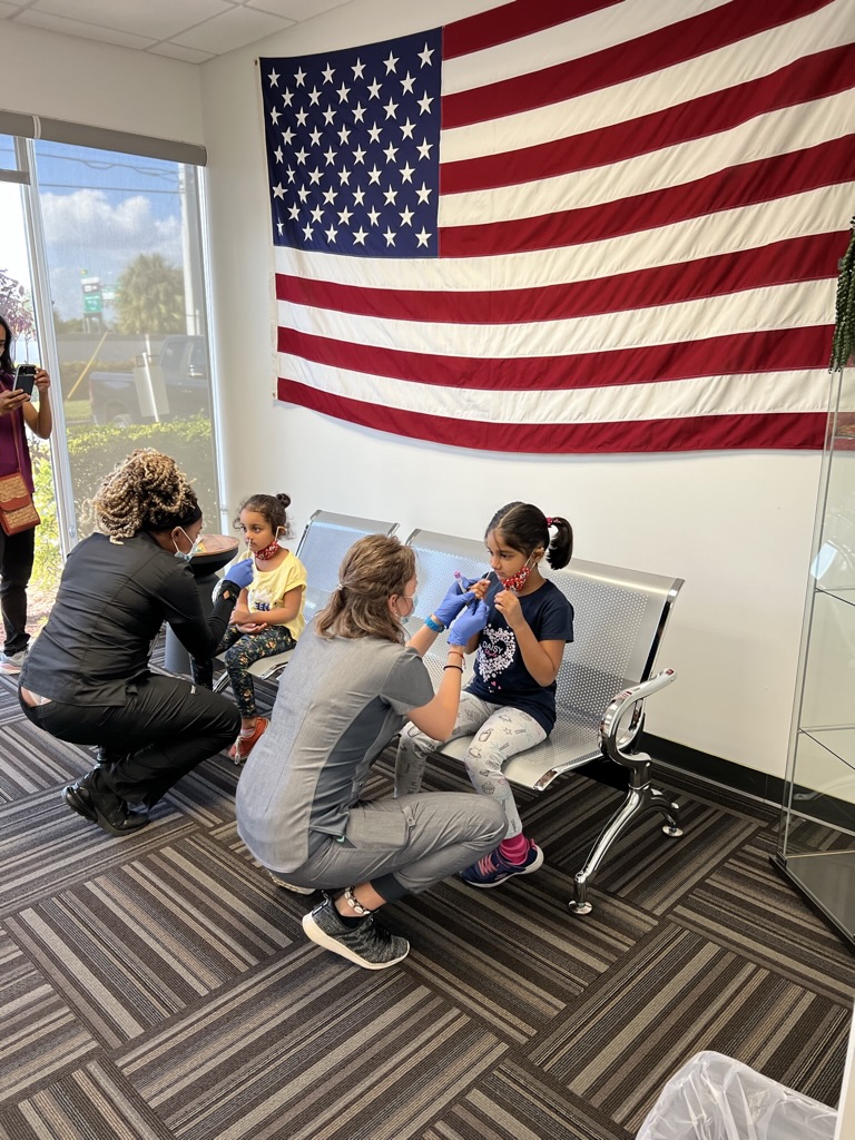 Synergy staff providing COVID-19 testing to children in Davie, Florida